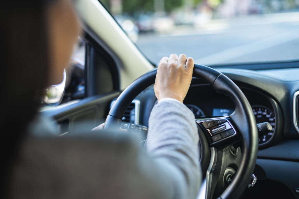 businesswoman driving her car city